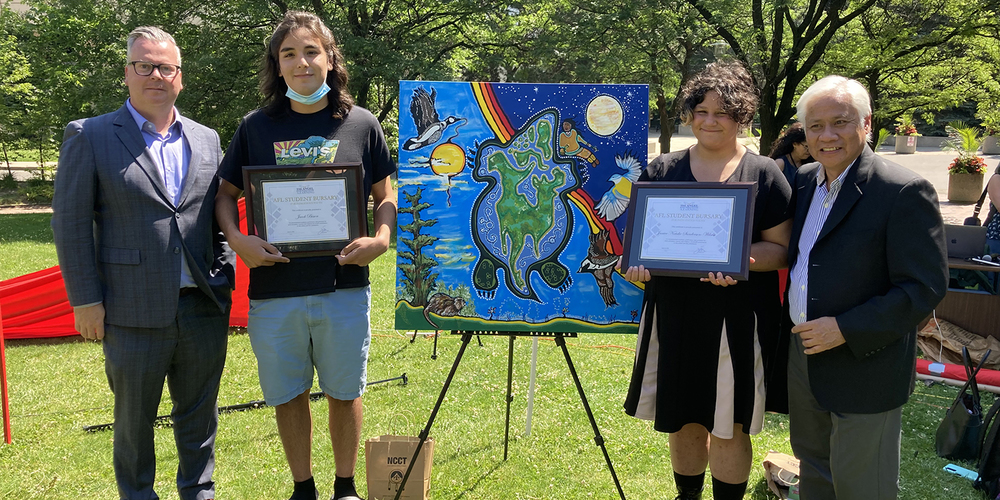Banner - Photo of award recipient posing with the Director of Education and AFL Director