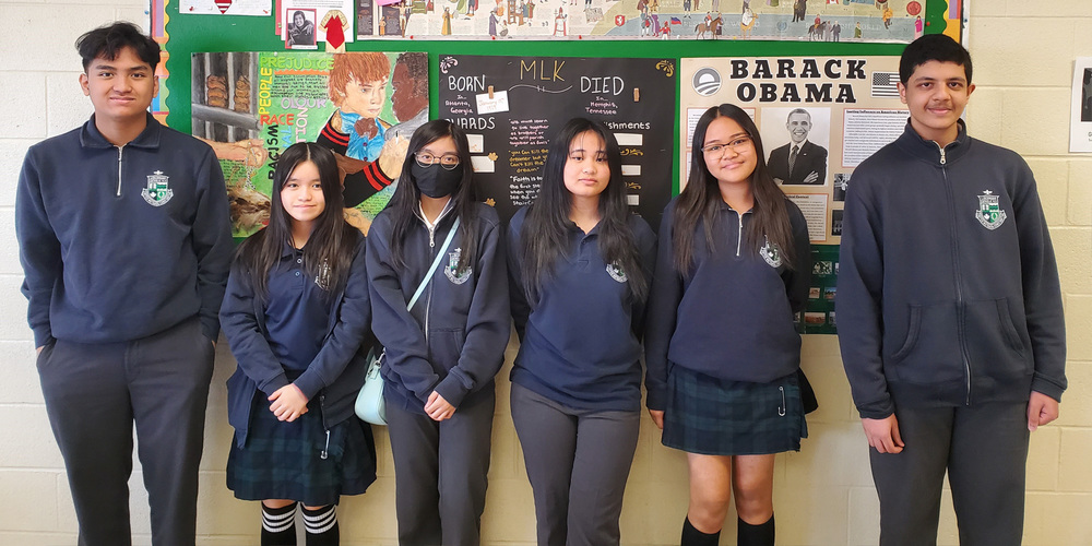 Banner - The six winning students of the Young Authors Awards, in Francis Libermann school uniform
