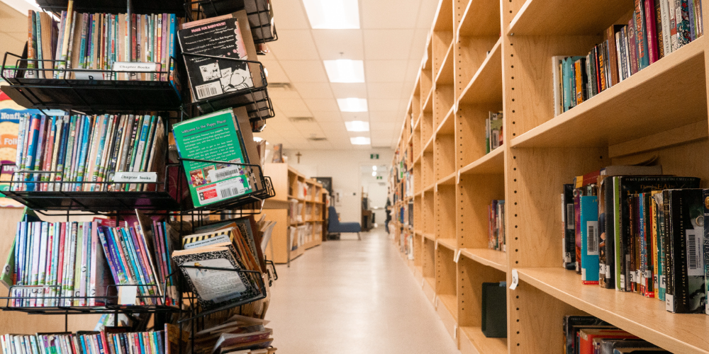 The inside of a school library with book shelves.