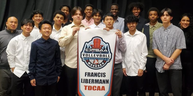 Banner - Francis Libermann Senior Boys Volleyball Team with Championship Banner