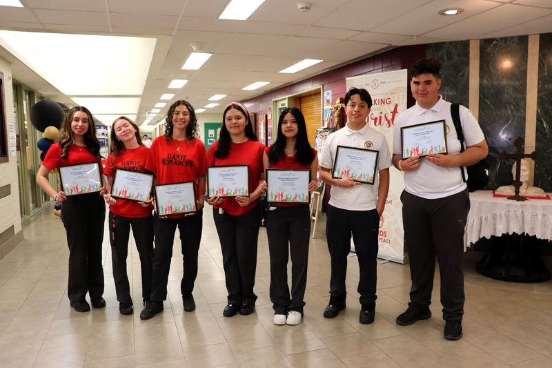 Seven students posing with their award. Photo credit: Joseph Vukman