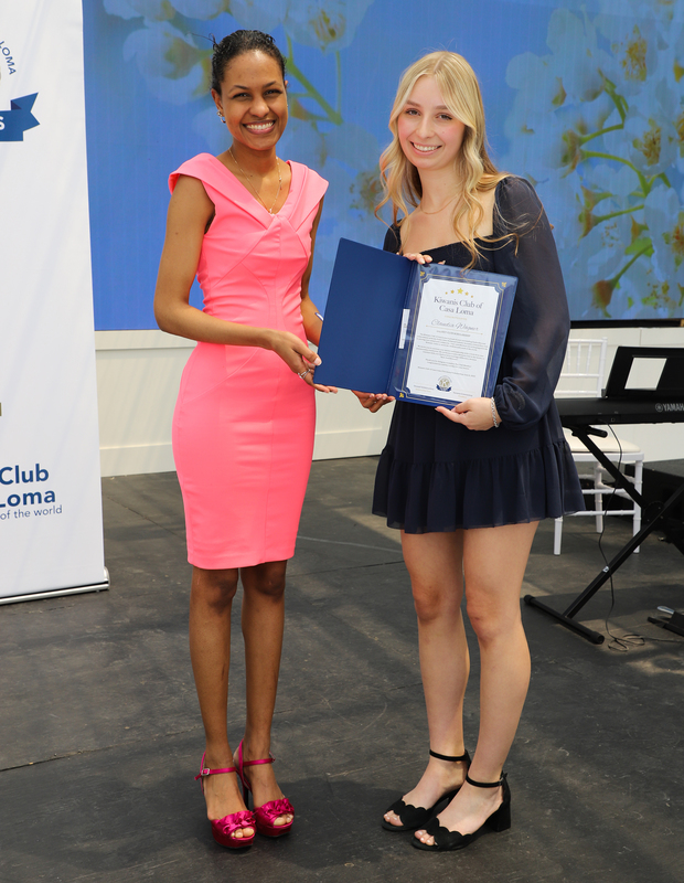 Photo of Claudia receiving the award