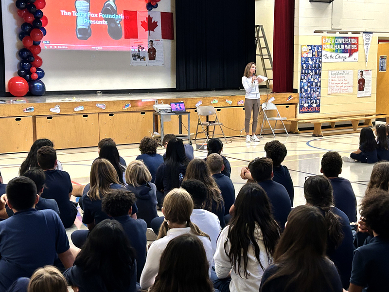  Teacher presenting to a group of students at the Terry Fox assembly