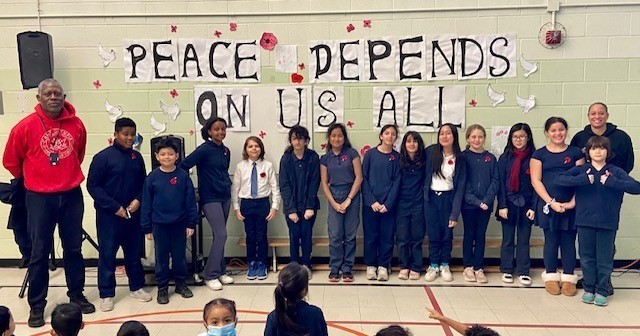 St. Kevin students and staff with Superintendent Danfulani at the St. Kevin Remembrance Day service