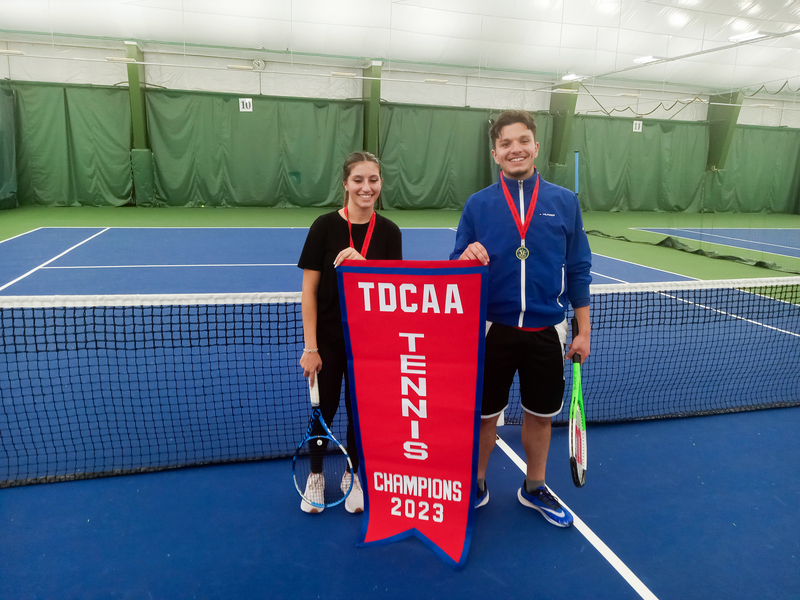 Mixed Doubles team of Pascal S. and Alessia S. with their TDCAA tennis championship banner