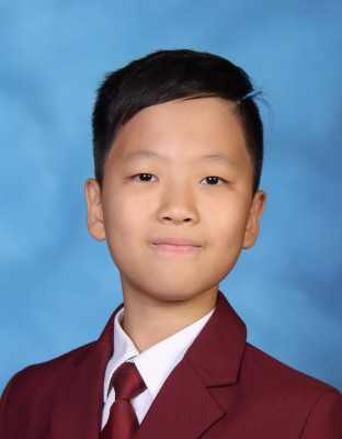 School photo of Ethan, who received a National Gold Medal from the RCM for his performance in Level 6 Guitar